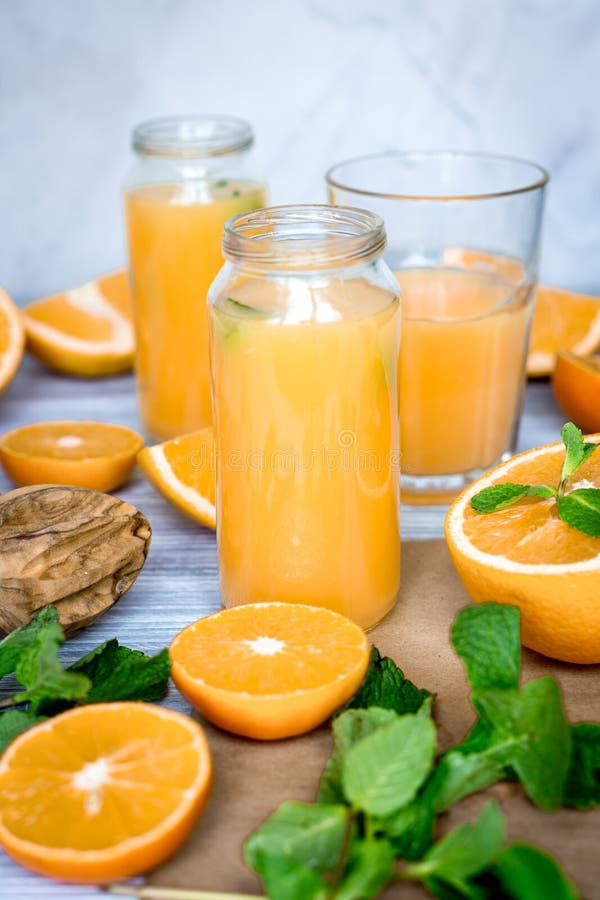 Healthy Morning with Orange Juice in Bottle on Kitchen Background Stock