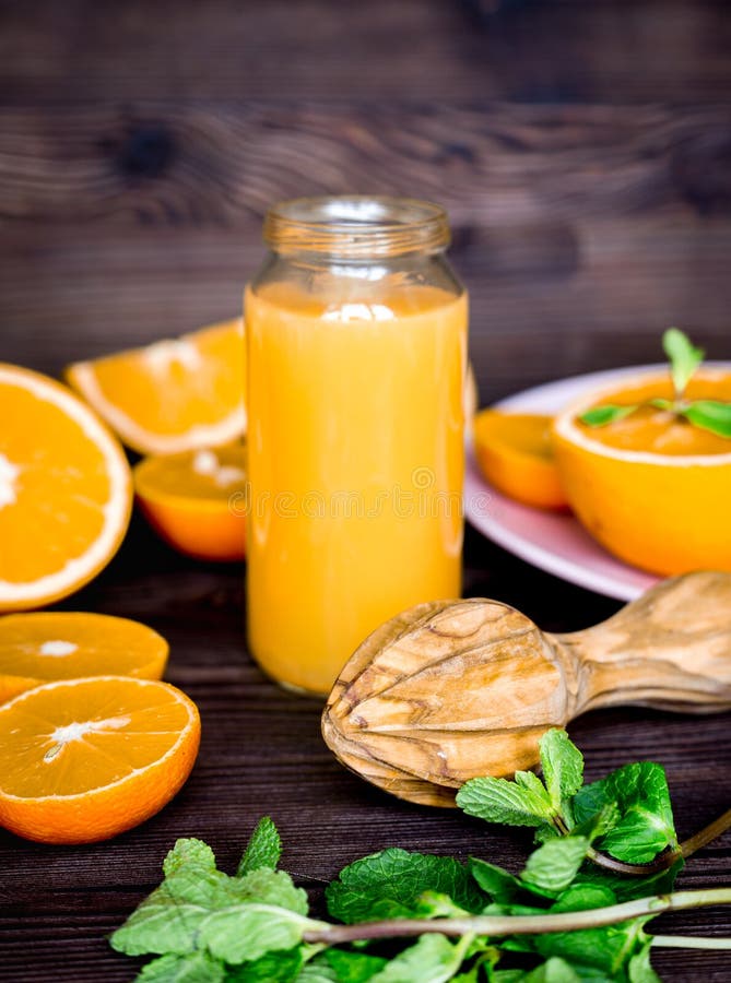 Healthy Morning with Orange Juice in Bottle on Kitchen Background Stock