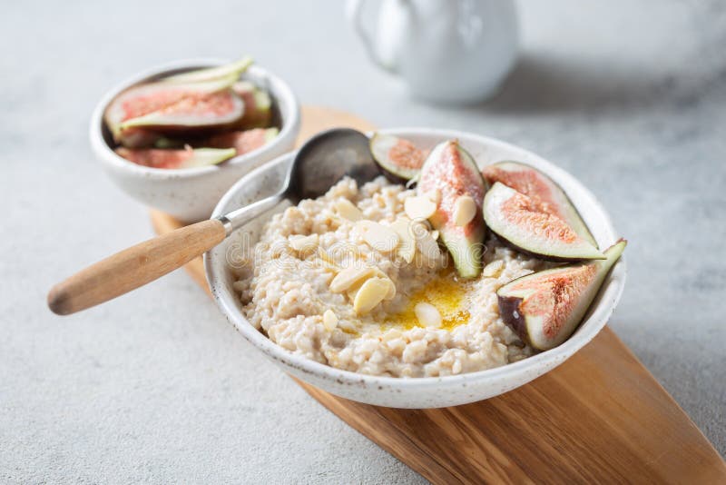 Healthy Oatmeal with Figs. Coffee, Oatmeal Breakfast Concept Stock