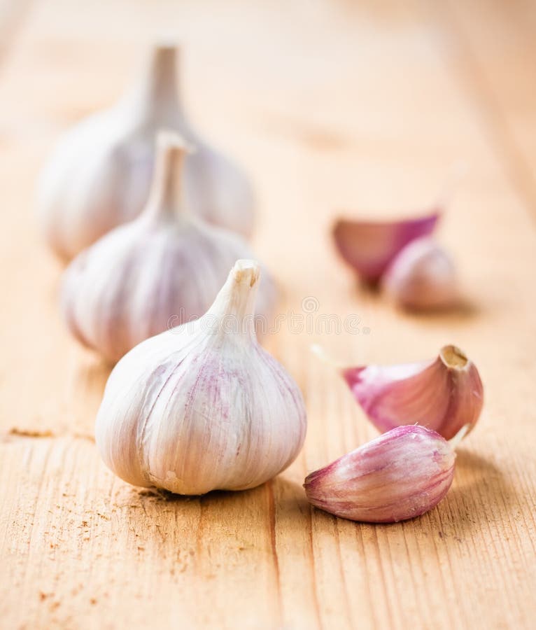 Healthy Organic Garlic Vegetables Whole And Cloves On The Wooden