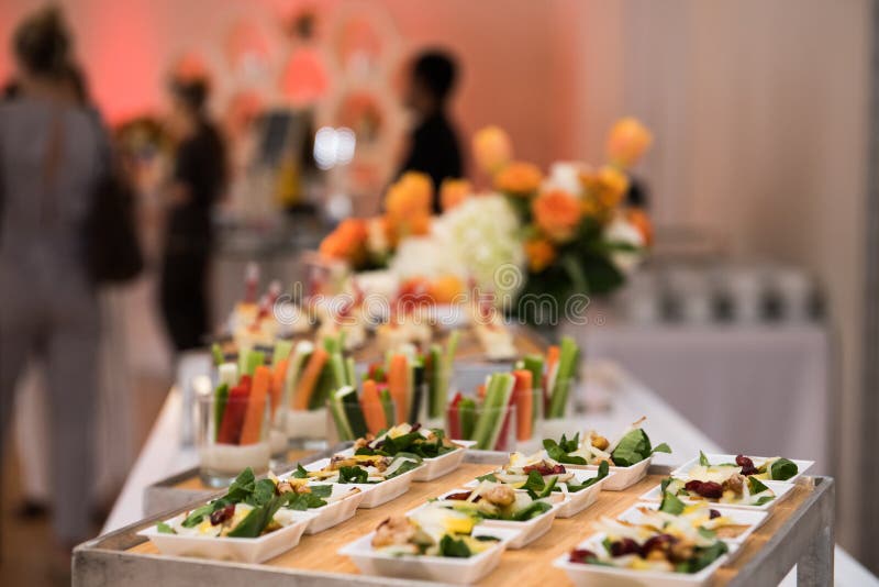 Healthy organic gluten-free delicious green snacks salads on catering table during corporate event partyÑŽ