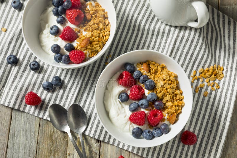 Healthy Organic Greek Yogurt with Granola and Berries Stock Photo