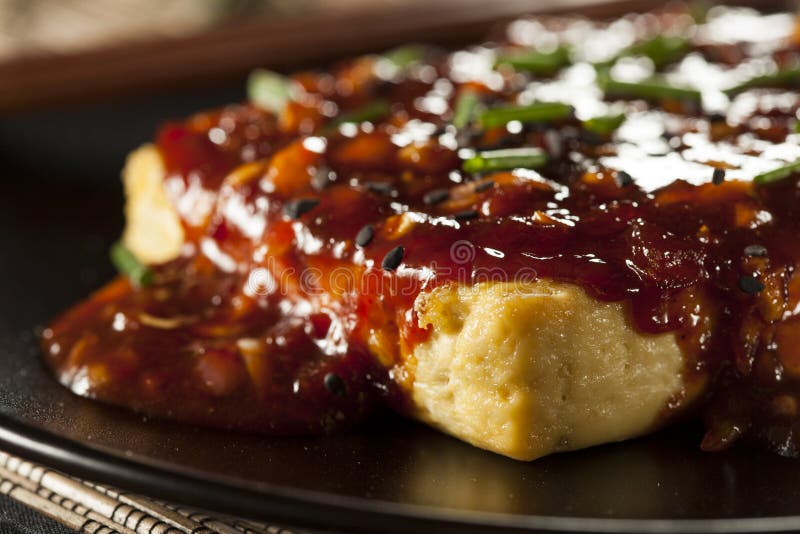 Healthy Organic Grilled Tofu with Spicy Garlic Sauce. And Chives royalty free stock image