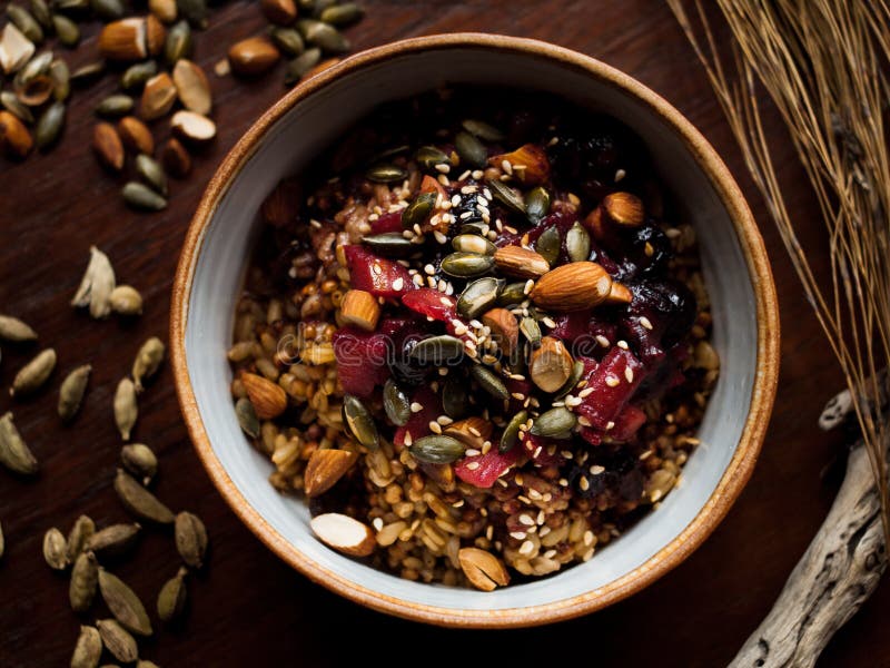 Healthy Roasted Nuts and Seeds Granola in Handmade Ceramic Bowl