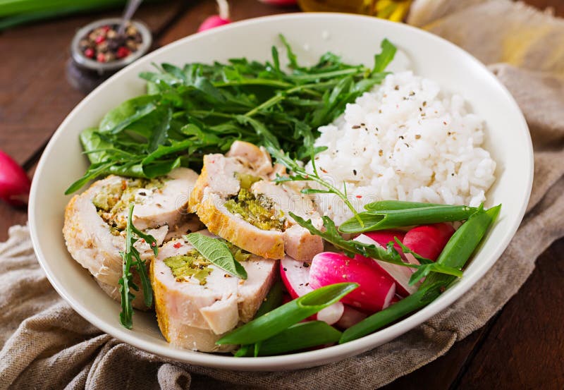 Healthy salad with chicken rolls, radishes, spinach, arugula and rice royalty free stock photos Healthy salad with chicken rolls, radishes, spinach, arugula and rice royalty free stock photos