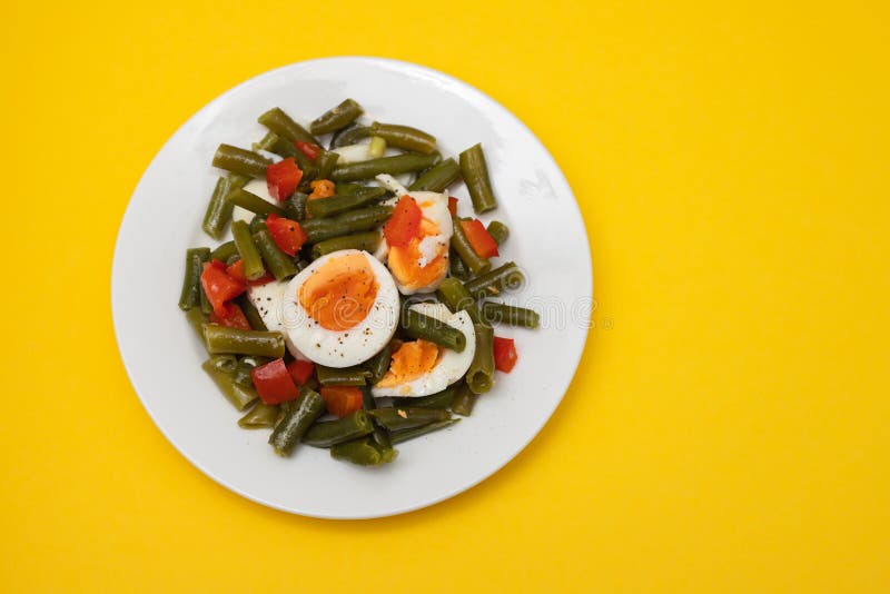 Healthy Salad Green Beans, Pepper and Boiled Eggs on Plate Stock Image