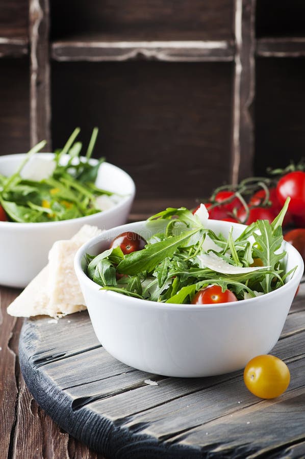 Healthy Salad with Rocket, Tomato and Parmesan Cheese Stock Photo