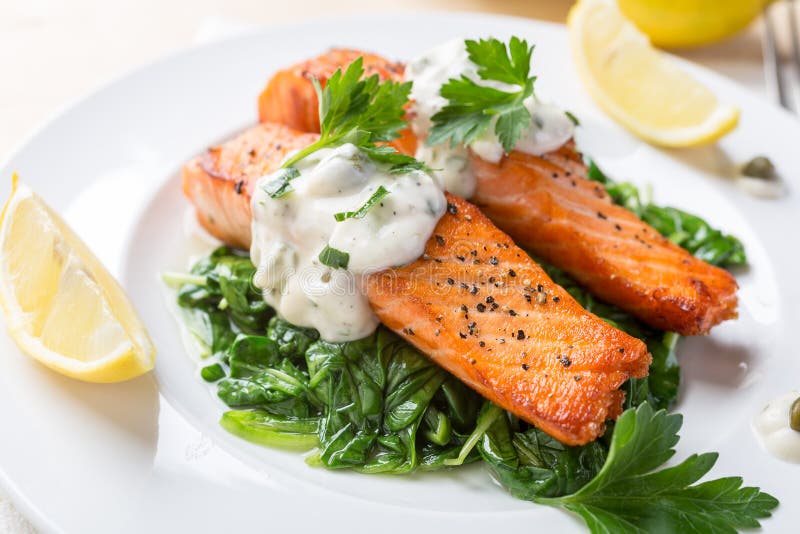 Healthy Salmon Steak on bed of spinach