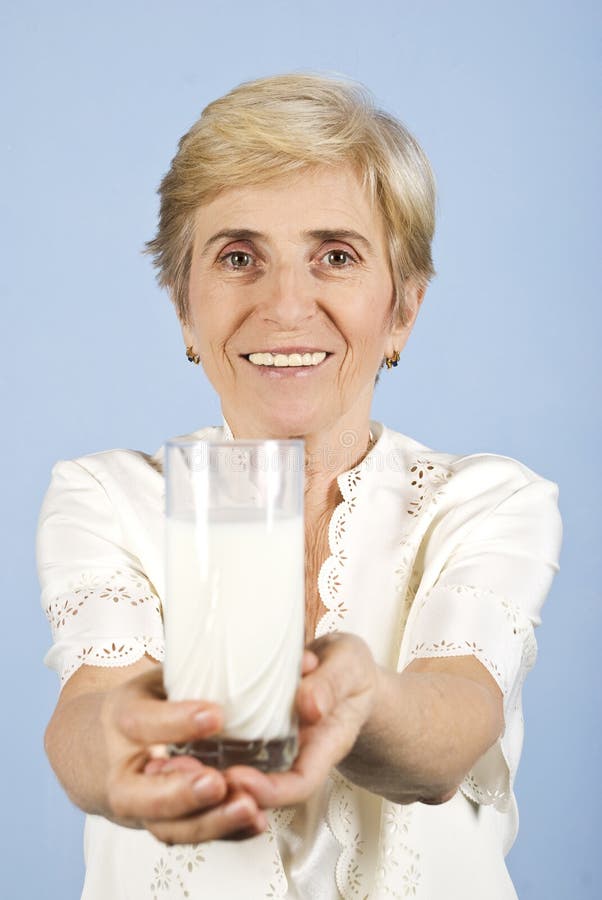 Healthy senior woman with milk glass stock photos Healthy senior woman with milk glass stock photos