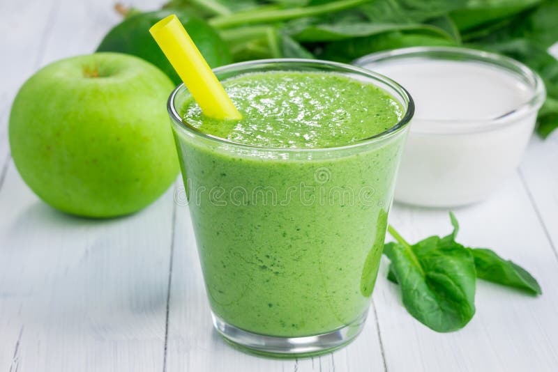 Healthy smoothie with green apple, spinach, lime and coconut milk stock photo Healthy smoothie with green apple, spinach, lime and coconut milk stock photo