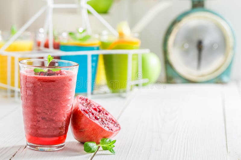 Healthy smoothie made of fresh pomegranate and mint