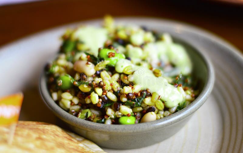 A Closeup Image Showing Healthy Superfood Salad with Rich Protein made by Quinoa, Avacado, Beans & Grains. A Closeup Image Showing Healthy Superfood Salad with Rich Protein made by Quinoa, Avacado, Beans & Grains.