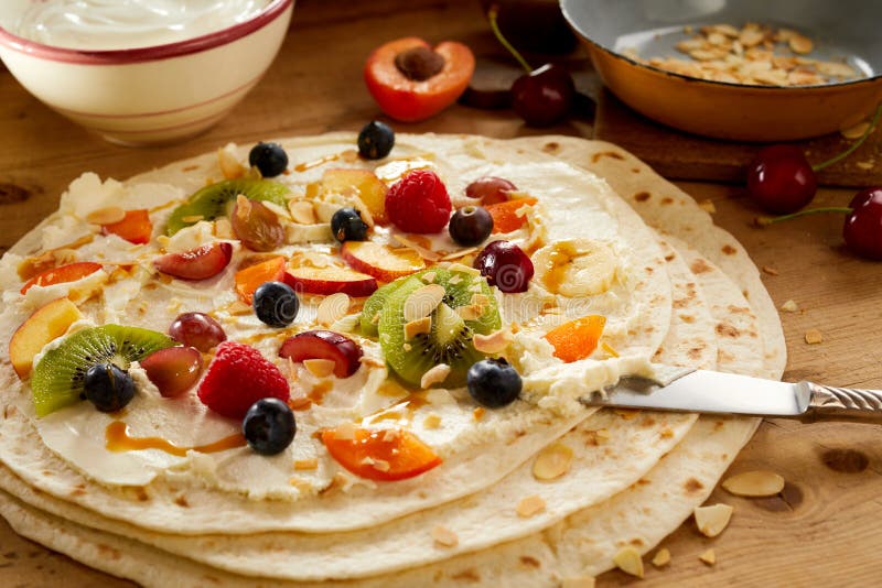 Healthy tropical fruit salad and cream in a wrap stock photography Healthy tropical fruit salad and cream in a wrap stock photography