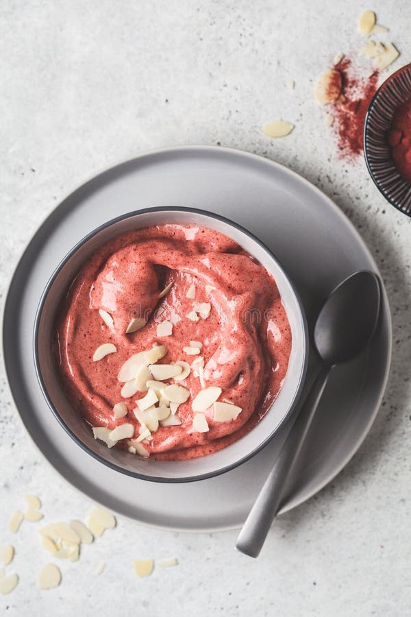 Healthy Vegan Breakfast Bowl. Beet Powder Smoothie in Gray Bowl Stock