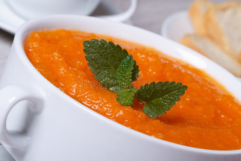 Healthy vegetable cream soup of carrots macro. Healthy vegetable cream soup of carrots in a white plate macro. horizontal stock photos Healthy vegetable cream soup of carrots macro. Healthy vegetable cream soup of carrots in a white plate macro. horizontal stock photos
