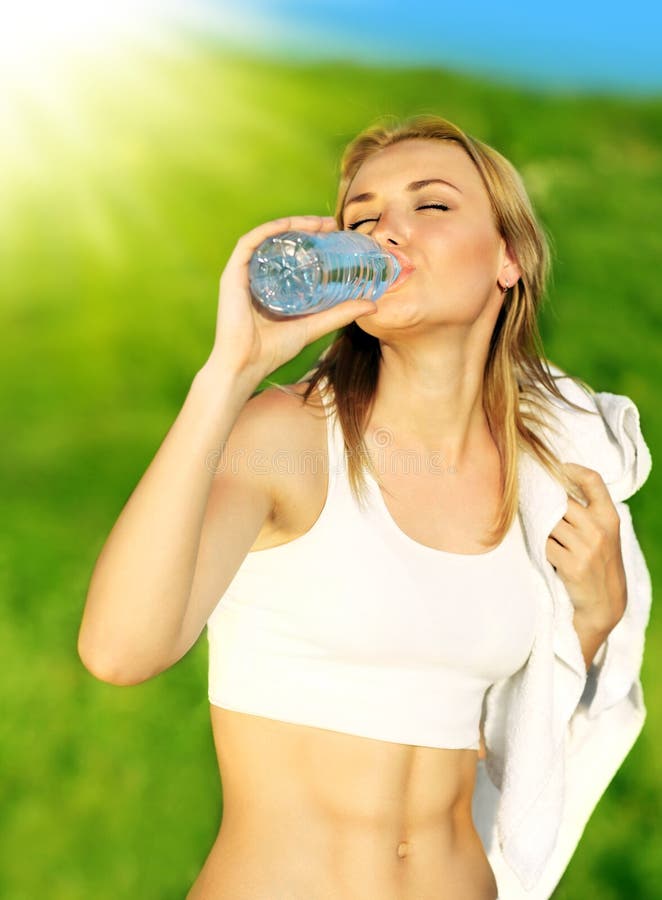 Healthy woman drinks water royalty free stock photo Healthy woman drinks water royalty free stock photo