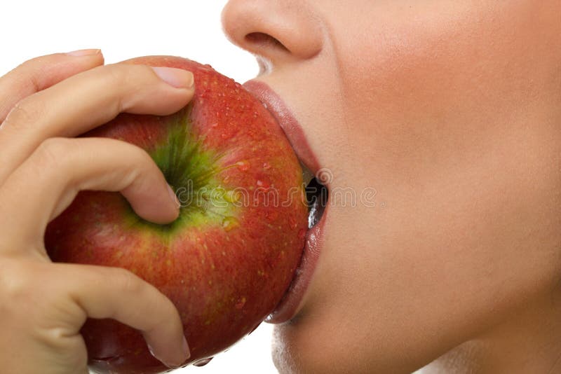 Healthy woman eating apple