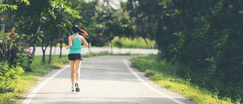 Healthy woman jogging run and workout on road outdoor. royalty free stock photography Healthy woman jogging run and workout on road outdoor. royalty free stock photography