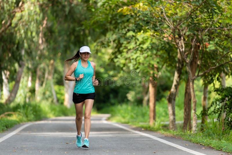 Healthy woman jogging run and workout on road outdoor. royalty free stock image Healthy woman jogging run and workout on road outdoor. royalty free stock image