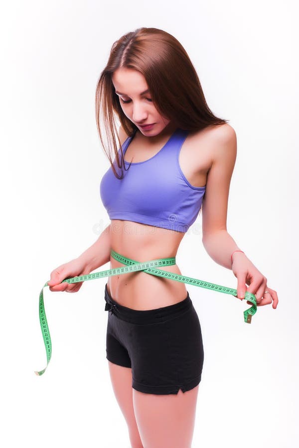 healthy young lady measuring her waist with a tape measure