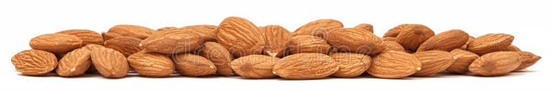 Heap of Almonds isolated on white background. Panorama macro of Almond nuts. Organic food