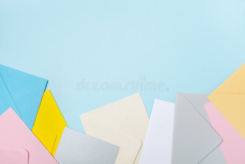 Heap of colorful envelopes on blue working desk top view. Mockup for business mail, blogging and office correspondence. Flat lay. royalty free stock photos Heap of colorful envelopes on blue working desk top view. Mockup for business mail, blogging and office correspondence. Flat lay. royalty free stock photos