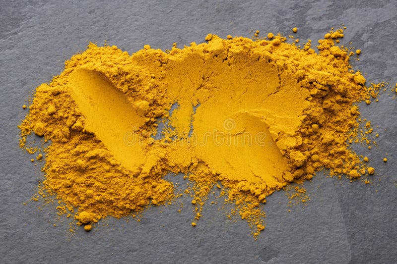 Heap of dried turmeric powder - Curcuma longa stock photography