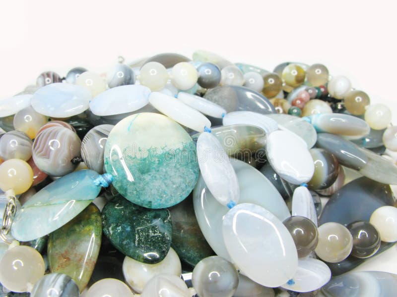 Heap of green blue and grey colored beads
