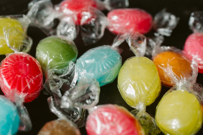 Heap of multicolor candies as texture and background for design. Many different candies of different flavors as background. royalty free stock images