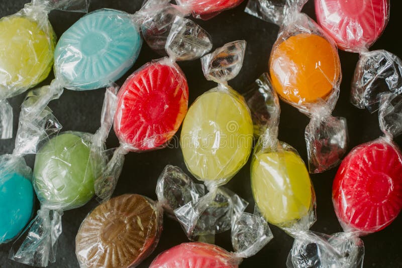 Heap of multicolor candies as texture and background for design. Many different candies of different flavors as background. stock photos