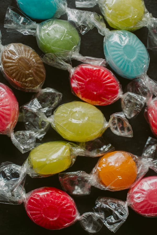 Heap of multicolor candies as texture and background for design. Many different candies of different flavors as background. royalty free stock images