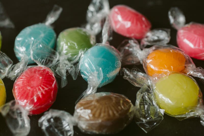 Heap of multicolor fruity candies as texture and background for design. Many different candies of different flavors. royalty free stock image