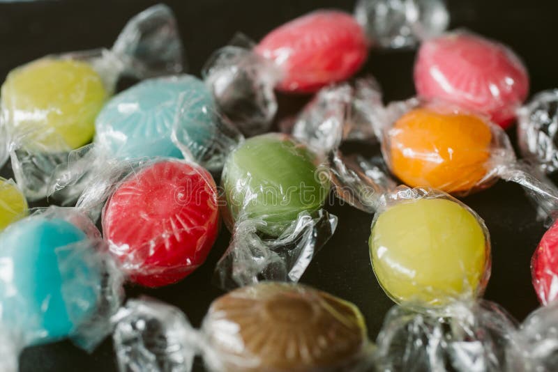 Heap of multicolor fruity candies as texture and background for design. Many different candies of different flavors. royalty free stock photo