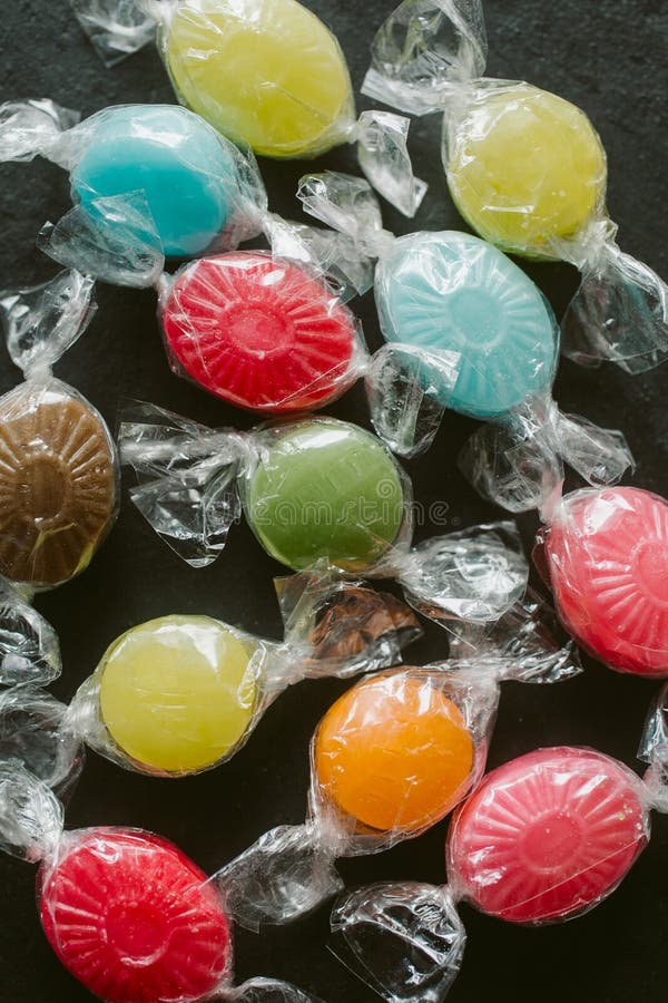 Heap of multicolor fruity candies as texture and background for design. Many different candies of different flavors. royalty free stock photos