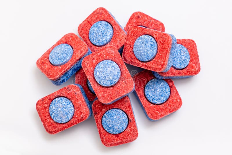 A Heap Pile of Red and Blue Dishwasher Soap Tablets on White Background