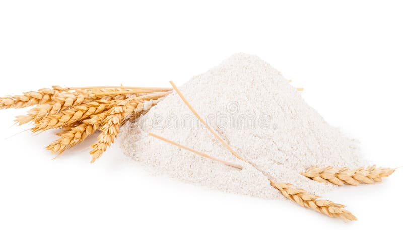 Heap of wheat flour with spikelets