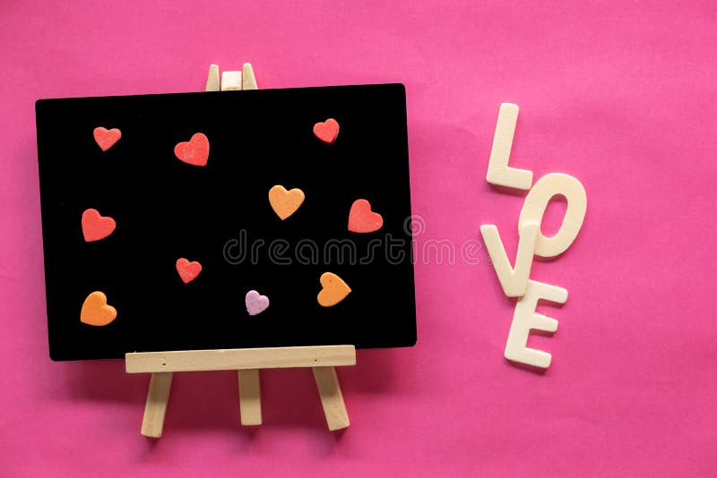heart in Blackboard and word LOVE on pink background, Love icon, valentine`s day stock photo heart in Blackboard and word LOVE on pink background, Love icon, valentine`s day stock photo
