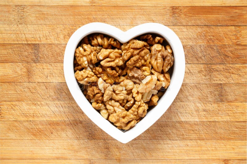 Heart filled with walnuts stock image. Image of wood 72188621