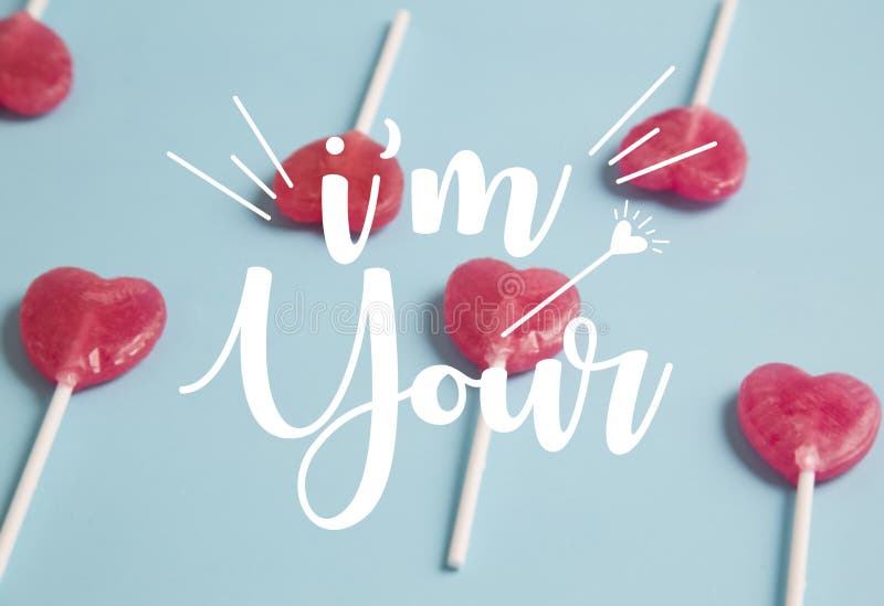 Heart Lollipop on Blue Background.Minimal Concept. Stock Photo Image