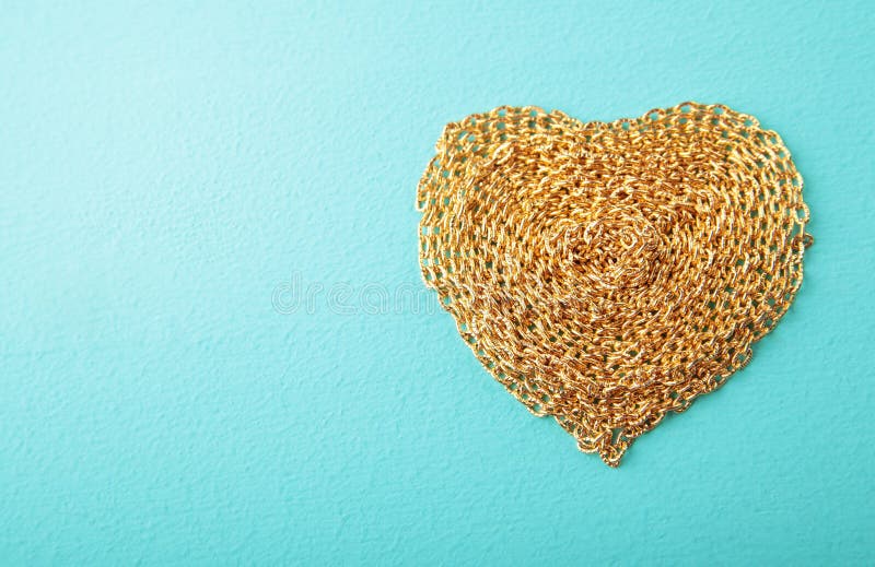 Heart made with gold chain wood texture