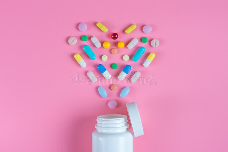 Heart of Pink Pills on a Blue Background Stock Photo Image of healthcare, macro 139192434