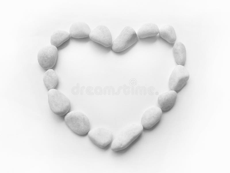 Heart pebbles frame stock photos