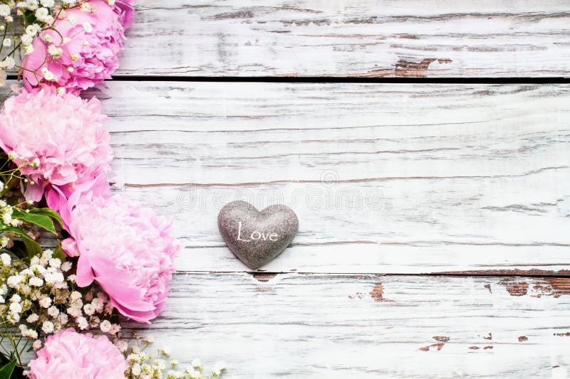 Pink Peonies and Babys Breath Flowers Over a White Wooden Background Stock  Photo - Image of feminine, fleur: 151415866