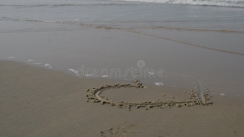 Painted heart on the beach. 4K stock footage