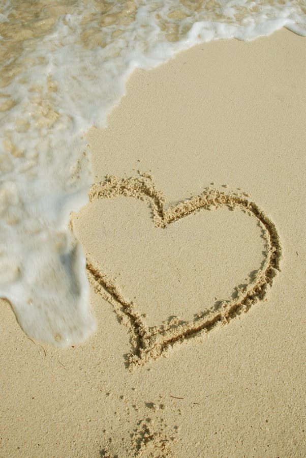 Heart on sandy beach