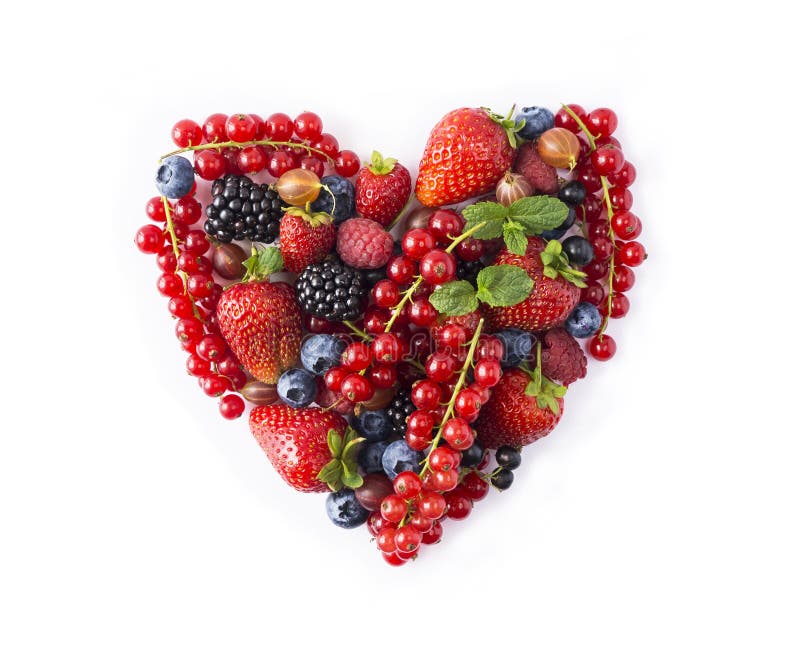 Heart shape assorted berry fruits on white background. Berries in heart shape isolated on a white. Ripe blueberries, red currants, stock images Heart shape assorted berry fruits on white background. Berries in heart shape isolated on a white. Ripe blueberries, red currants, stock images