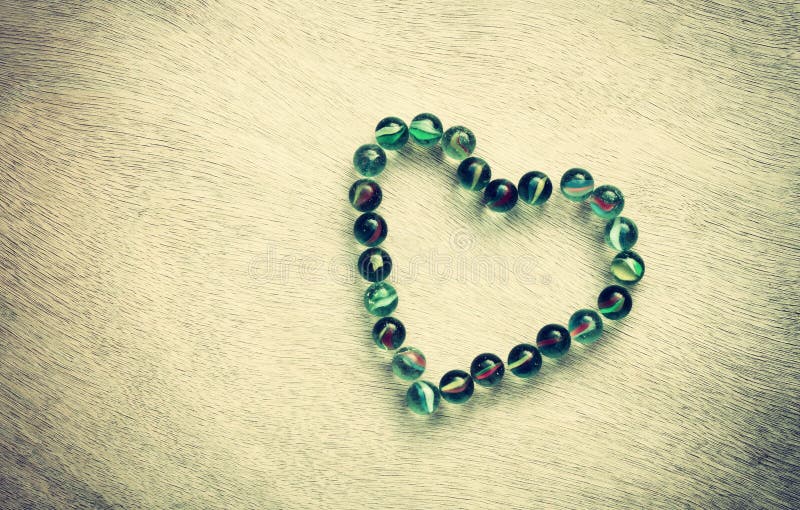 Heart shape made from marbles with vintage effect. valentines day concept or wedding concept. room for text. stock photos Heart shape made from marbles with vintage effect. valentines day concept or wedding concept. room for text. stock photos