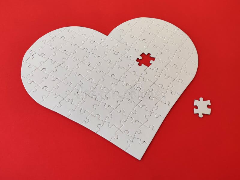 Heart Shaped Blank White Jigsaw Puzzle on Red Background Puzzle Pieces