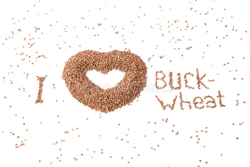 Heart-shaped bowl of roasted buckwheat on bwhite background. Gluten free and healthy diet. I love buckwheat concept royalty free stock photos Heart-shaped bowl of roasted buckwheat on bwhite background. Gluten free and healthy diet. I love buckwheat concept royalty free stock photos