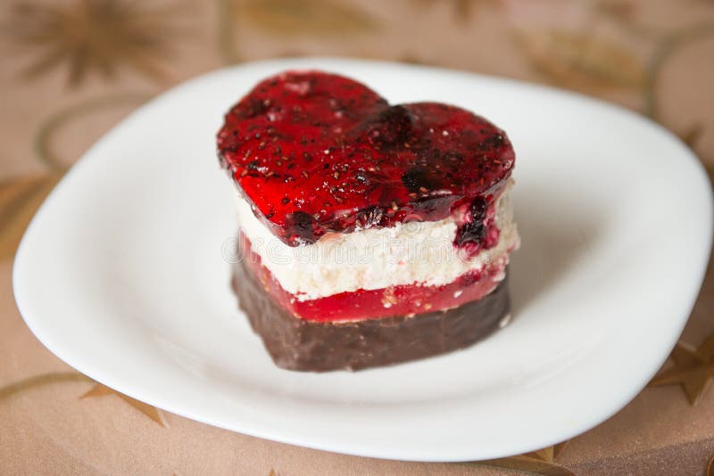 Heart shaped chocolate cake. cake in the shape of a heart on a white plate.